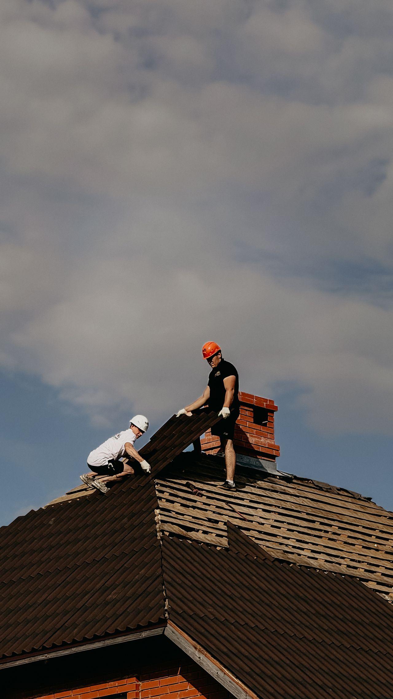 Professional roofing team working on a roof